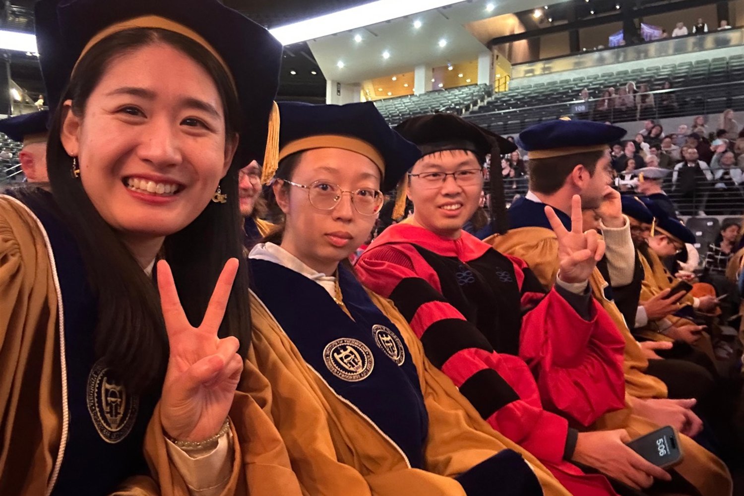 Lifei Yin, Bingqing, and Pengfei Liu celebrating at the Georgia Tech graduation ceremony