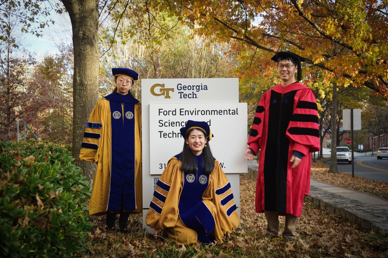 Bingqing Zhang and Lifei Yin with Pengfei Liu in academic regalia at Georgia Tech